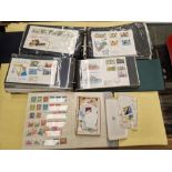 A box containing First Day Covers, stamp album and loose stamps