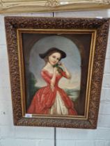 A 19th century school, oil on canvas, three quarter length portrait of a young woman, 34cm x 44.5cm,