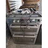 A Hotpoint oven and grill with four ring gas hob.