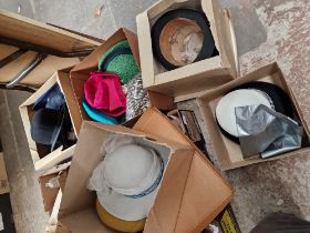A collection of vintage hats, including a top hat, police hat etc.