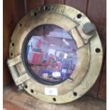 A brass port hole window.