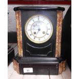 A small slate and marble mantle clock