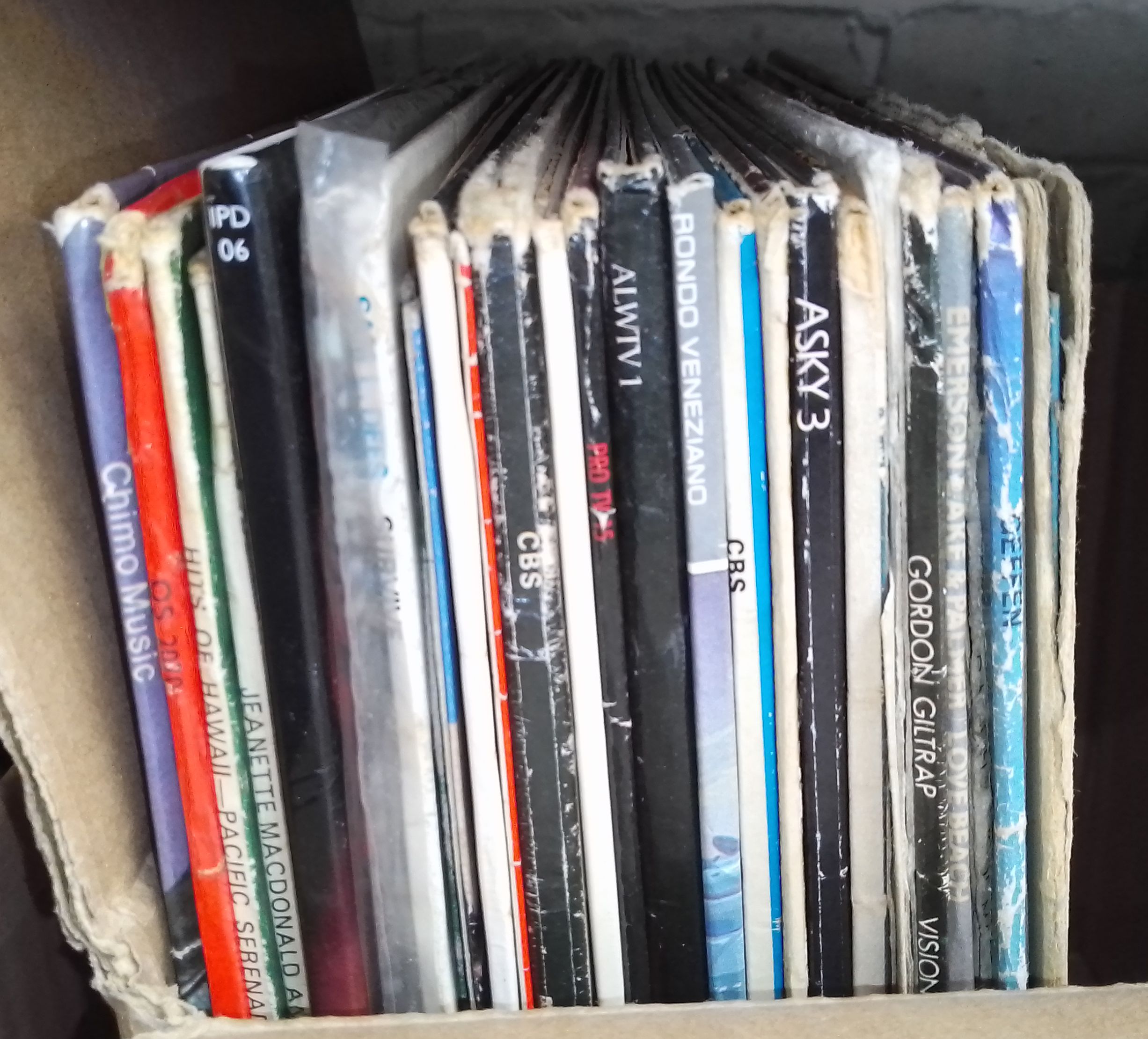A box of vinyl LP records, rock and pop including Fleetwood Mac, Emmerson Lake & Palmer, Curved Air,
