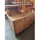 A 1930s stripped oak court cupboard.