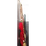 A collection of 5 fishing rods including beech handled 3 piece rod, Shakespeare Patriot beachcaster,