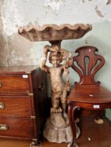 An Italian carved wood putti with half clam shell above his head, height 101cm.