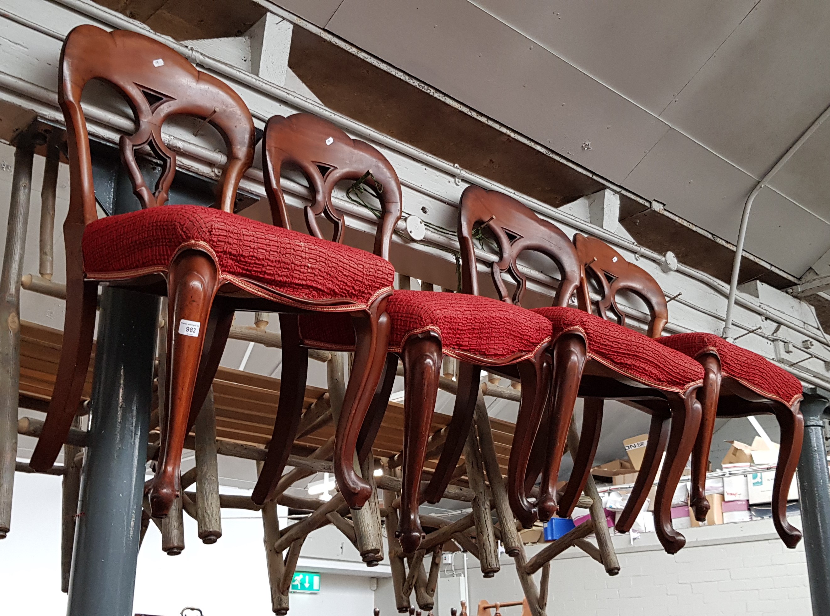 A set of four Victorian mahogany dining chairs with cabriole legs.