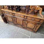 An aged oak sideboard, length 169cm.