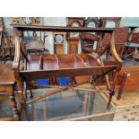 A Regency style mahogany book trough/table.