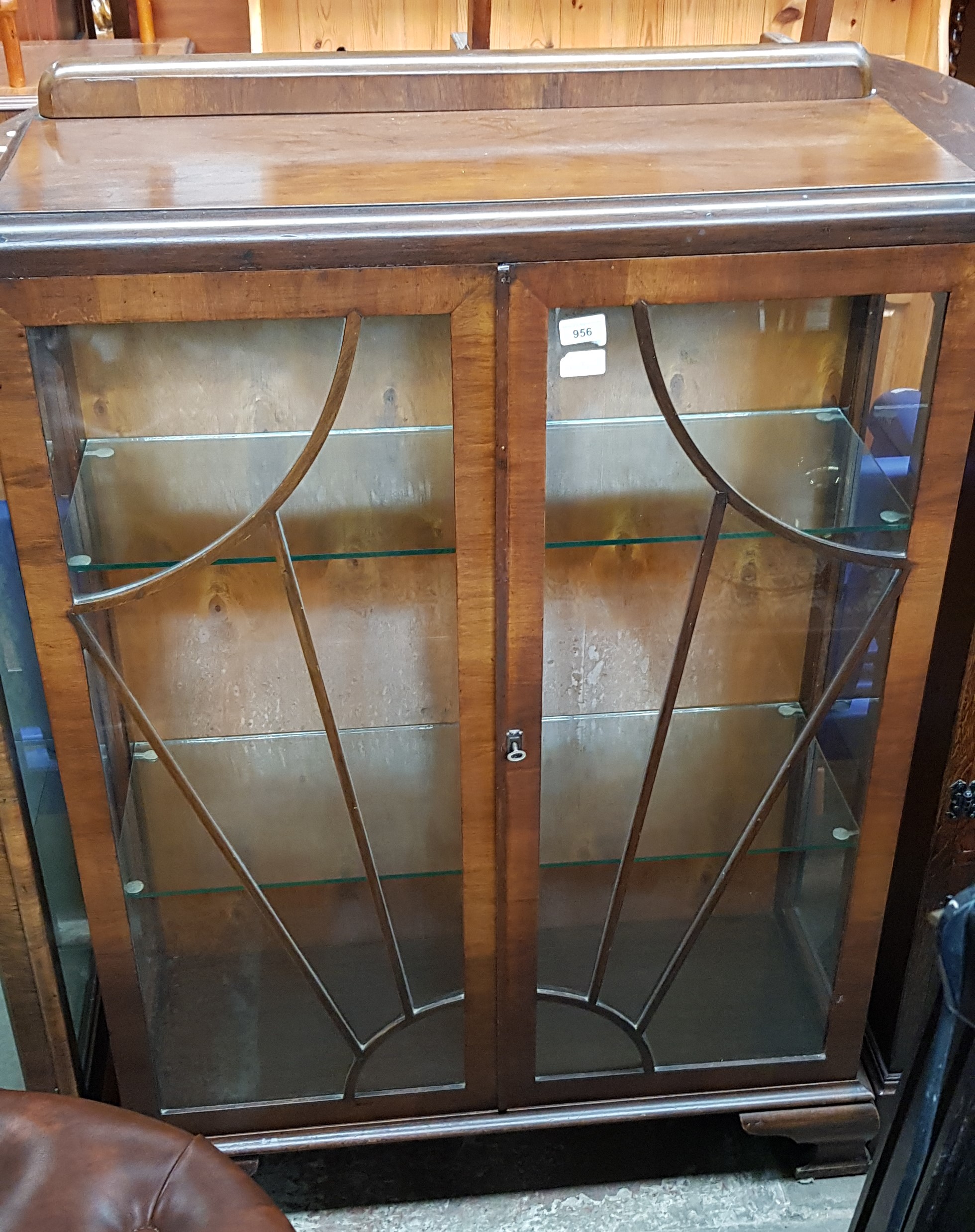 A 1930s Art Deco walnut display cabinet.