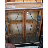 A 1930s Art Deco walnut display cabinet.