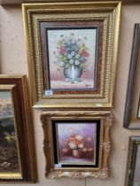 Two still life oil paintings of flowers, one on canvas and one on board signed Robert Cox, each