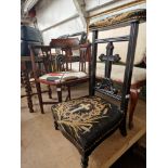 A 19th century ebonised Prie Dieu chair together with an Edwardian inlaid mahogany tub chair.