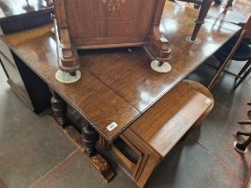 A 1930s oak metamorphic table settee.