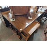 A 1930s oak metamorphic table settee.