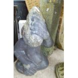 A polished stone garden ornament formed as a monkey, a concrete column, a mushroom, tortoise,