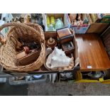 A box of assorted collectables including carved wood, a basket, a large conch shell, novelty