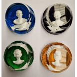 A group of four assorted Baccarat glass paperweights with encased Royal portraits.
