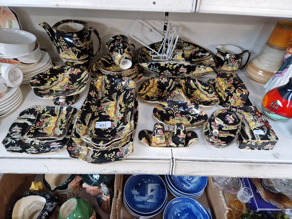 Collection of Royal Winton Grimwades table ware in black and yellow Chinese style - approx. 25