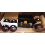 Four sets of crown green bowls.