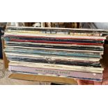 A box of assorted LPs, including Beatles, Fleetwood Mac, Kate Bush etc.