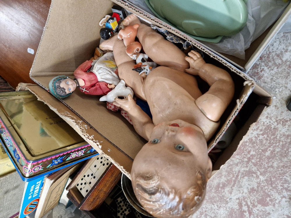 A box including a vintage composition doll, Robertson figures, ceramics animals.