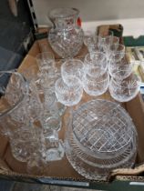 Assorted glass including a Waterford bird, cut glass vases and drinking glasses.