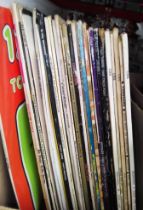 A box of vinyl LP records, rock and pop including Simon & Garfunkel, Bob Dylan, etc.