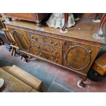 An early 20th century mahogany sideboard on ball and claw feet.