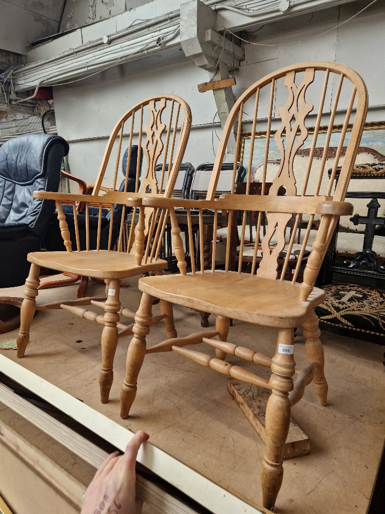 A pair of beech Windsor armchairs.