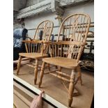 A pair of beech Windsor armchairs.