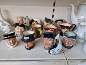 12 Royal Doulton small character jugs including Jester, Mine host, Drake etc. All in good
