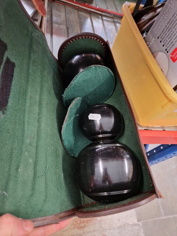 A set of crown green bowls, 2 Full bias, in leather case