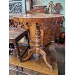 A Victorian oak and walnut parquetry inlaid pedestal table with various specimen woods to the top.