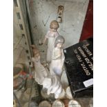 Three Nao figurines and Lladro polar bear figurine. All in good condition with no evidence of chips,