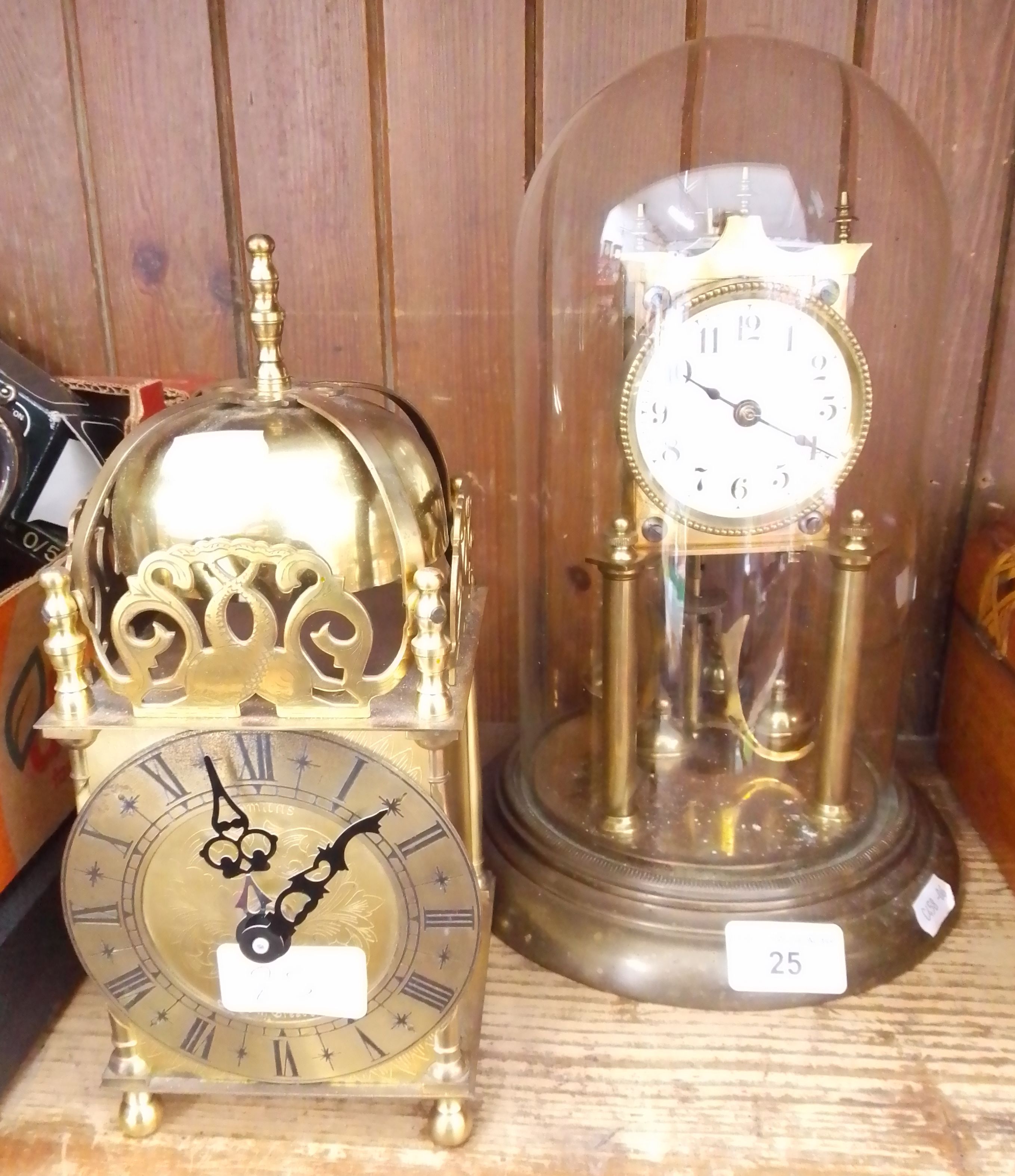 A 400 day German clock under glass dome and a brass lantern clock.