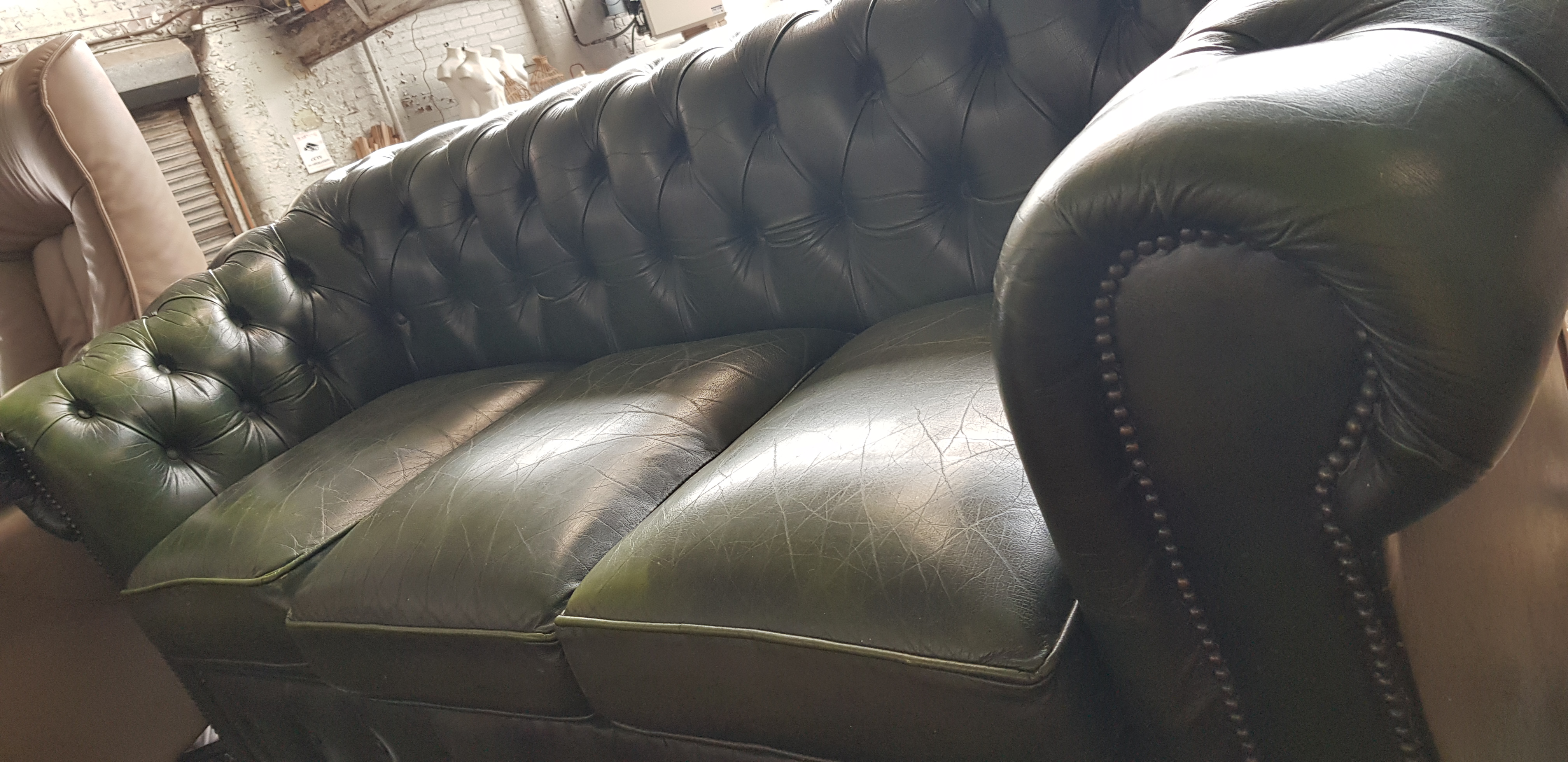 A green leather Chesterfield suite comprising three seater sofa, club chair, wingback armchair and - Image 2 of 4