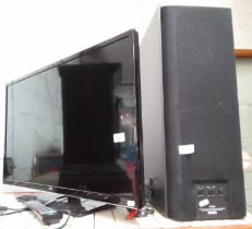 A Yamaha active servo processing sub woofer system and a 32" JVC smart tv with remote