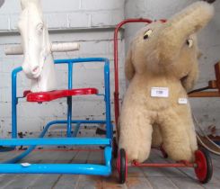 A Triang rocking horse and a vintage elephant on wheels by Pedigree Soft Toys.