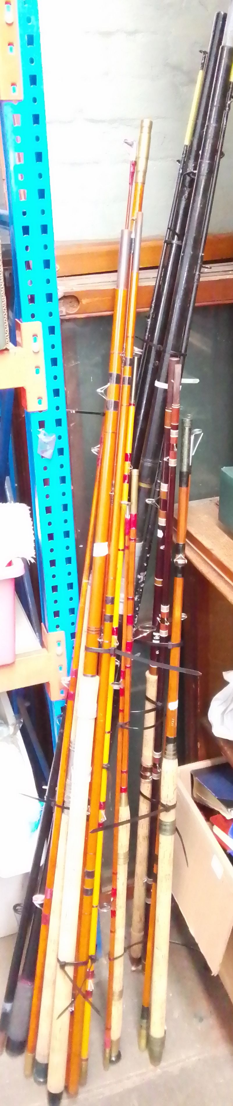 A collection of assorted fishing rods to include, 2 beach castors, 3 fibre glass coarse rods & 3