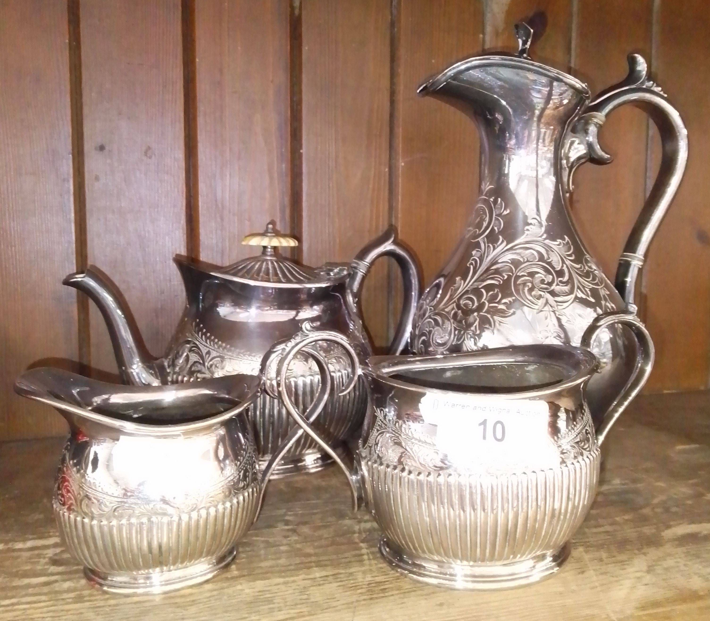 A late Victorian three piece silver plated tea set together with a matched silver plated coffee pot.