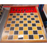 A boxed chess set with cast metal pieces
