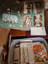 A box containg assorted postcards, cigarette cards, geeting cards & ephemera etc.