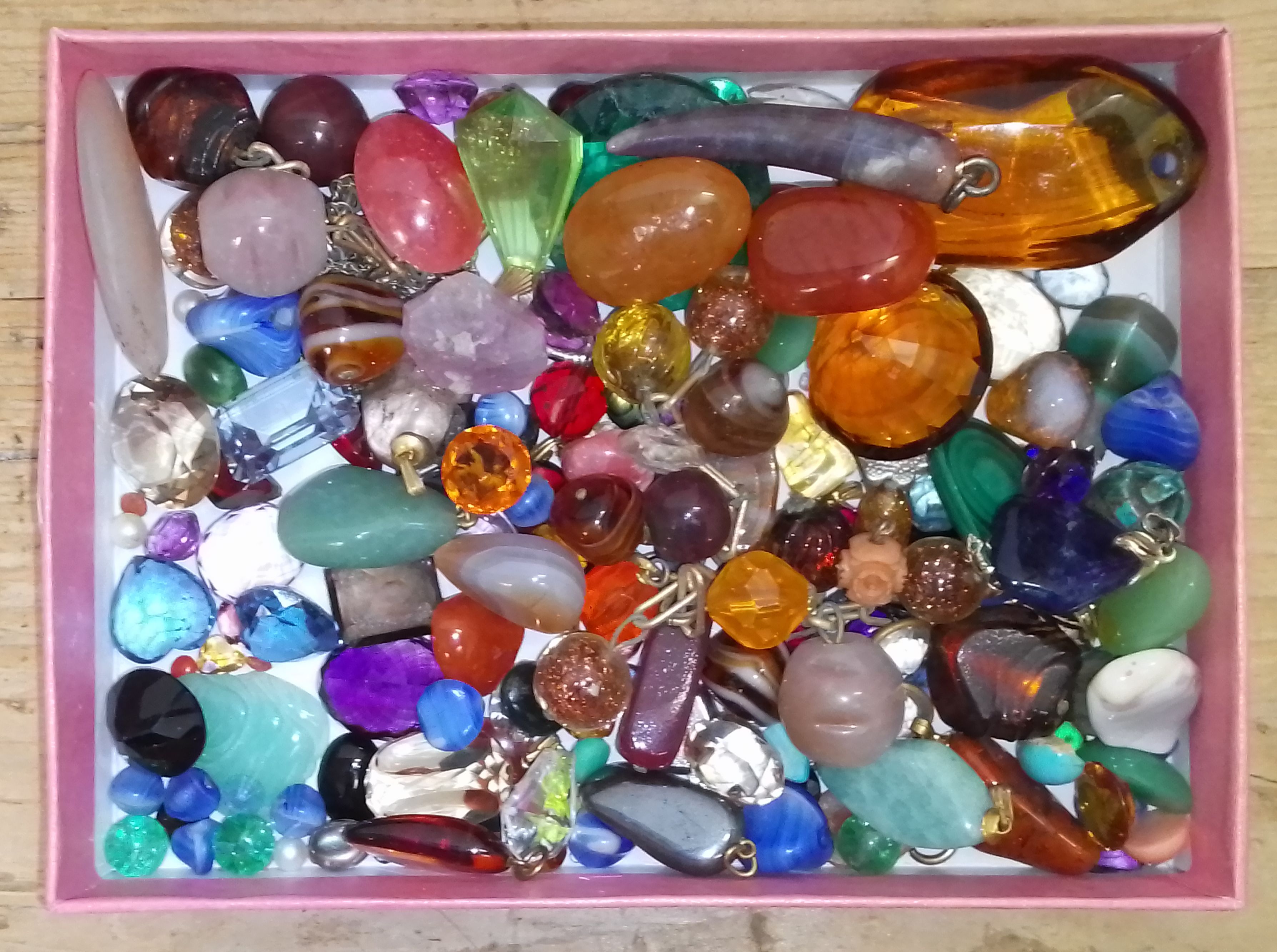 A box of mainly assorted loose gemstones, various crystalline, polycrystalline and paste varieties.