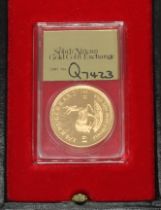 A South Africa 1/4 oz Krugerrand with case.
