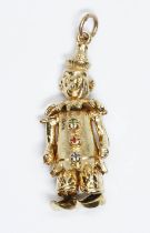 A hallmarked 9ct gold charm modelled as an articulated clown, length 34mm, weight 5.8g.