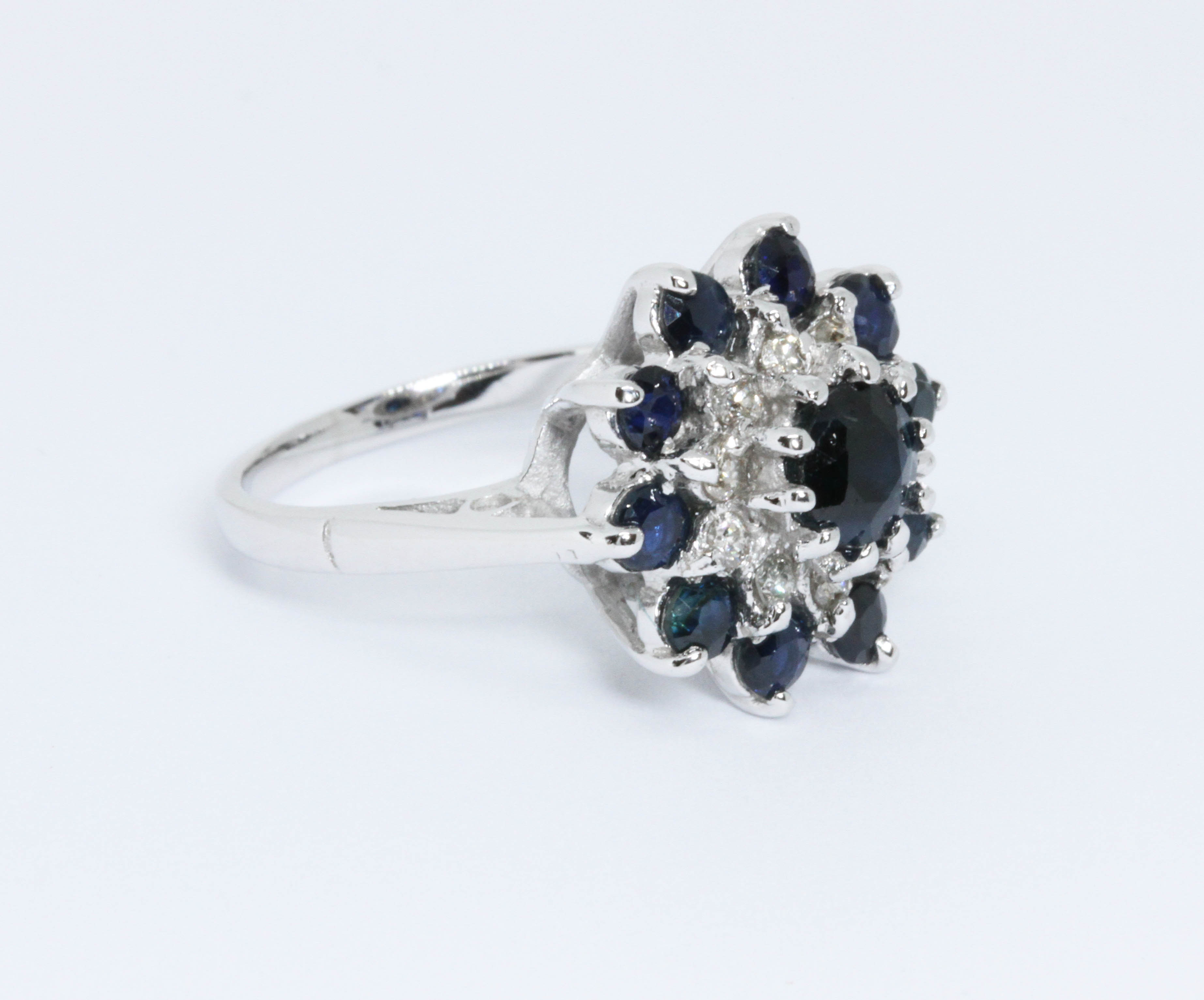 A diamond and sapphire cluster ring, the cluster measuring approximately 16mm in diameter, white - Image 3 of 5