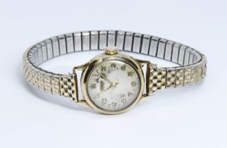 A ladies 9ct gold Tissot wristwatch, gold plated flexi strap.
