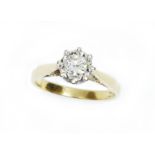 A diamond solitaire ring, the illusion set round brilliant cut diamond weighing approximately 0.35