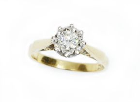 A diamond solitaire ring, the illusion set round brilliant cut diamond weighing approximately 0.35